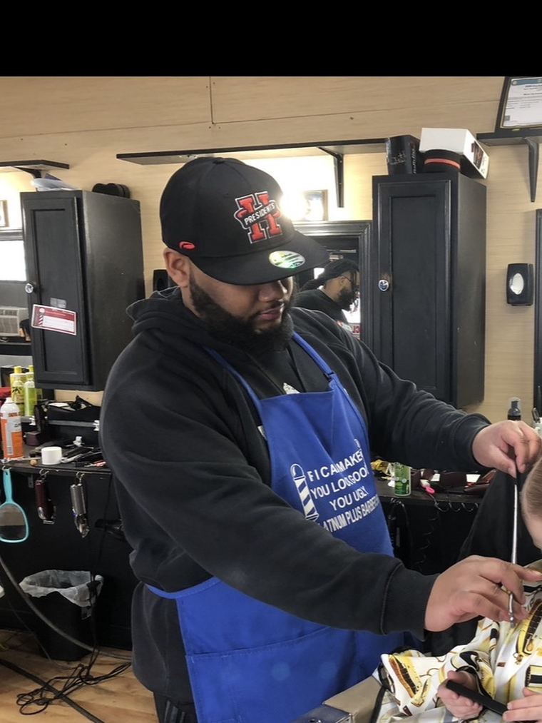 Daveon working in his barbershop